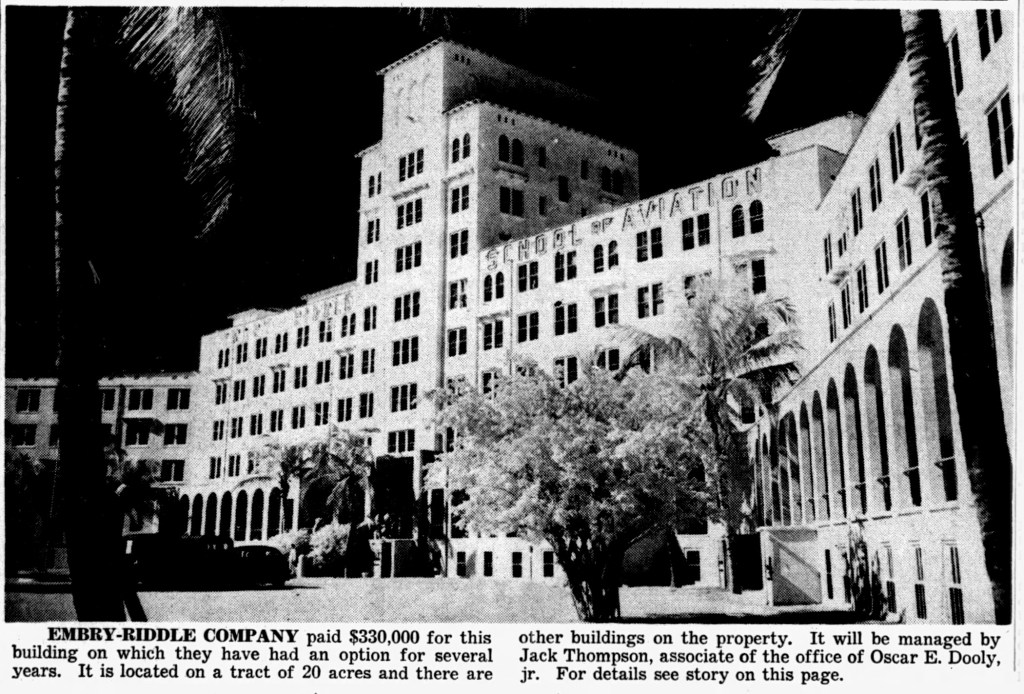Historical image of the Emby-Riddle Company building, featuring the 'School of Aviation' sign, surrounded by palm trees.